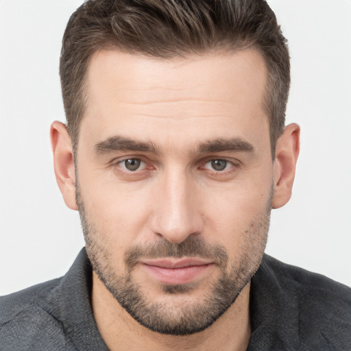 Joyful white young-adult male with short  brown hair and brown eyes