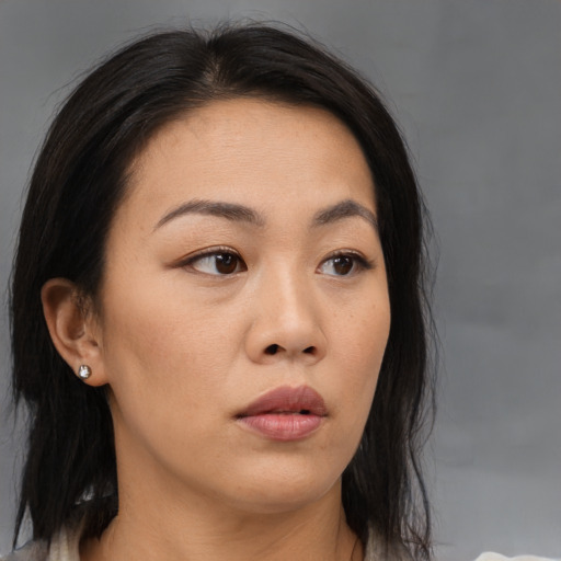 Neutral asian young-adult female with medium  brown hair and brown eyes