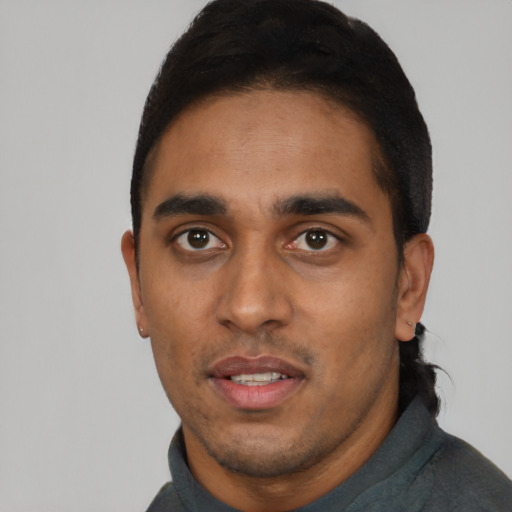Neutral black young-adult male with short  black hair and brown eyes