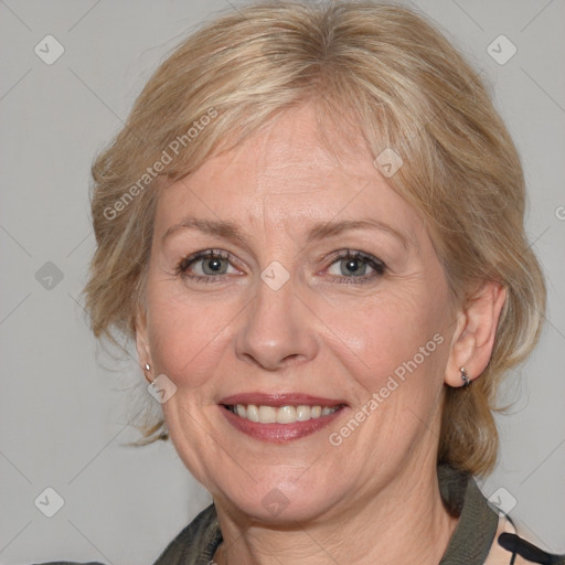 Joyful white adult female with medium  brown hair and blue eyes