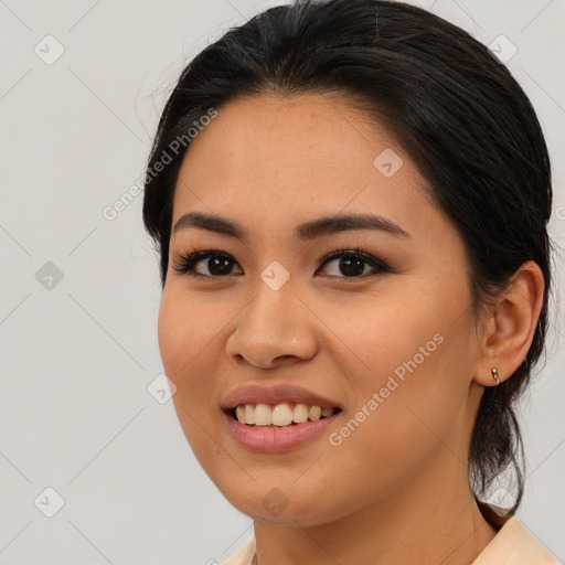 Joyful asian young-adult female with medium  brown hair and brown eyes