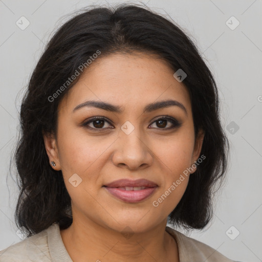 Joyful latino young-adult female with medium  brown hair and brown eyes