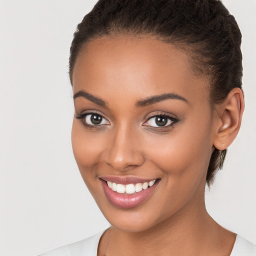 Joyful latino young-adult female with short  brown hair and brown eyes