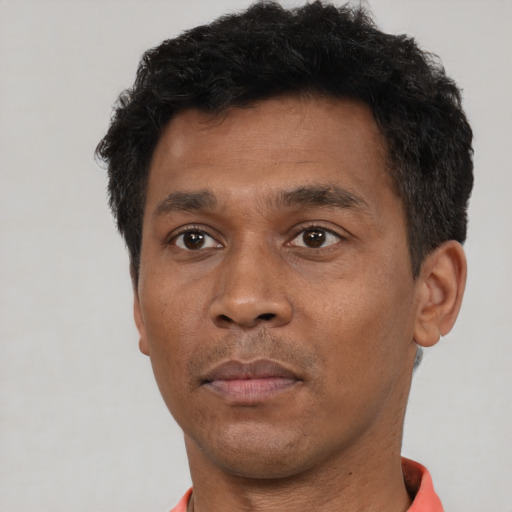 Neutral black adult male with short  brown hair and brown eyes
