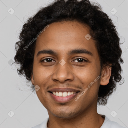 Joyful black young-adult male with short  brown hair and brown eyes