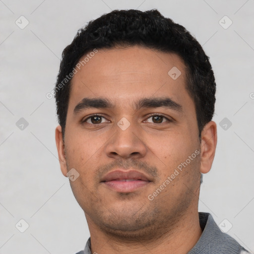 Neutral latino young-adult male with short  black hair and brown eyes