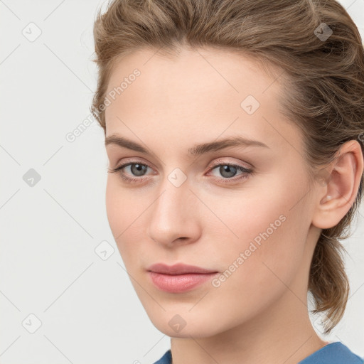 Neutral white young-adult female with medium  brown hair and grey eyes