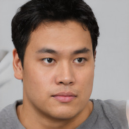 Neutral asian young-adult male with short  brown hair and brown eyes