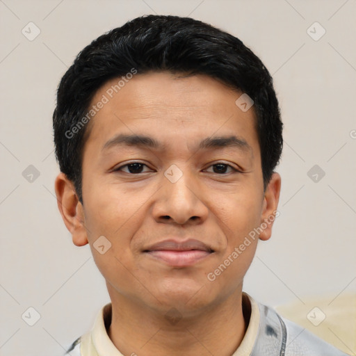 Joyful latino young-adult male with short  black hair and brown eyes