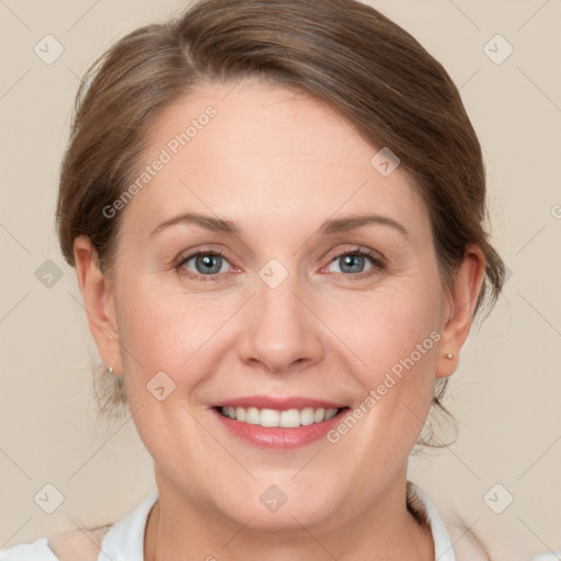 Joyful white adult female with medium  brown hair and grey eyes