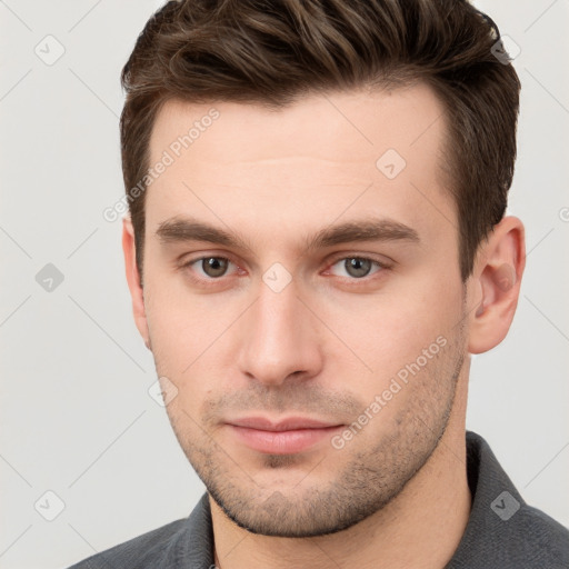 Neutral white young-adult male with short  brown hair and grey eyes