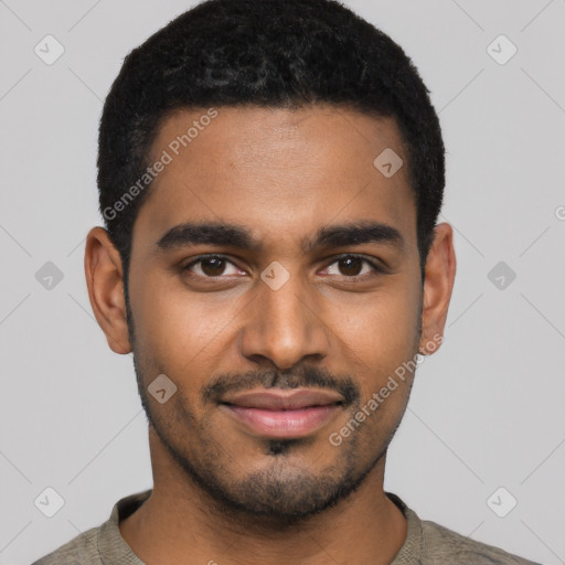 Joyful black young-adult male with short  black hair and brown eyes