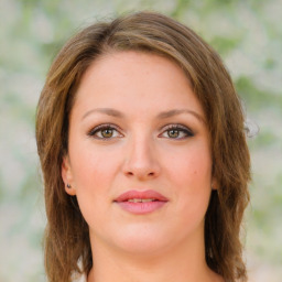 Joyful white young-adult female with medium  brown hair and green eyes