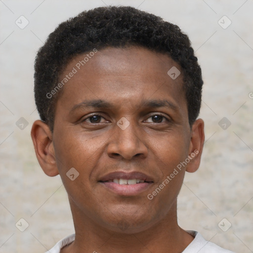 Joyful black young-adult male with short  brown hair and brown eyes