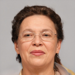 Joyful white middle-aged female with short  brown hair and brown eyes