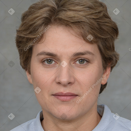 Joyful white adult female with short  brown hair and grey eyes