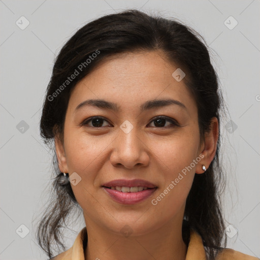 Joyful latino young-adult female with medium  brown hair and brown eyes