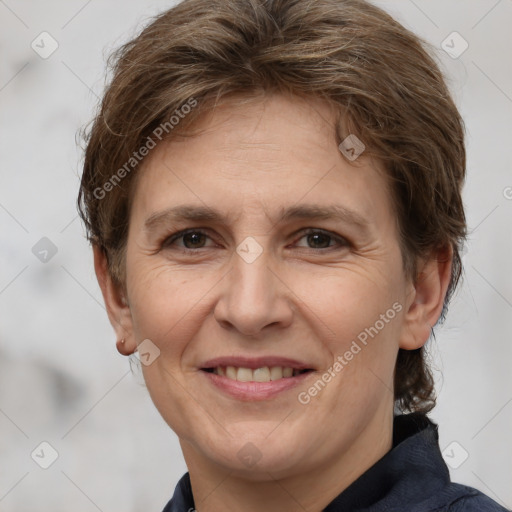 Joyful white adult female with medium  brown hair and brown eyes