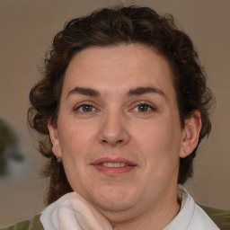 Joyful white young-adult male with medium  brown hair and brown eyes