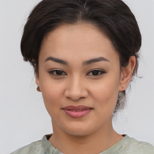 Joyful asian young-adult female with medium  brown hair and brown eyes