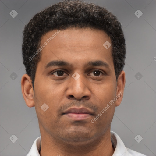 Neutral latino young-adult male with short  brown hair and brown eyes