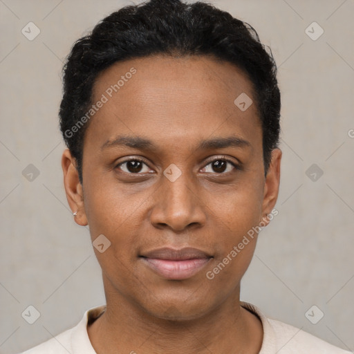 Joyful black young-adult male with short  black hair and brown eyes