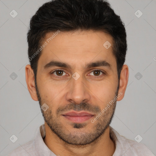 Joyful white young-adult male with short  black hair and brown eyes
