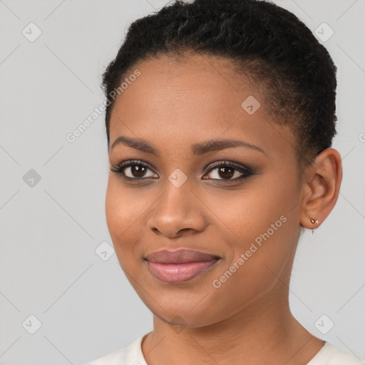 Joyful black young-adult female with short  brown hair and brown eyes