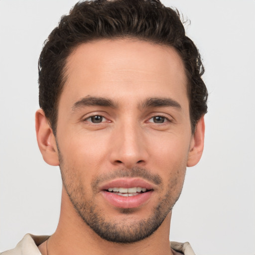 Joyful white young-adult male with short  brown hair and brown eyes