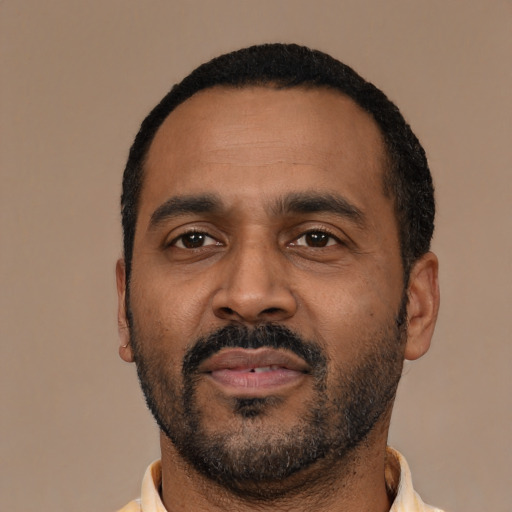 Neutral latino adult male with short  black hair and brown eyes