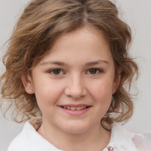 Joyful white child female with medium  brown hair and brown eyes