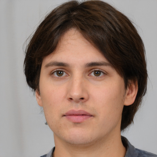 Neutral white young-adult male with medium  brown hair and brown eyes