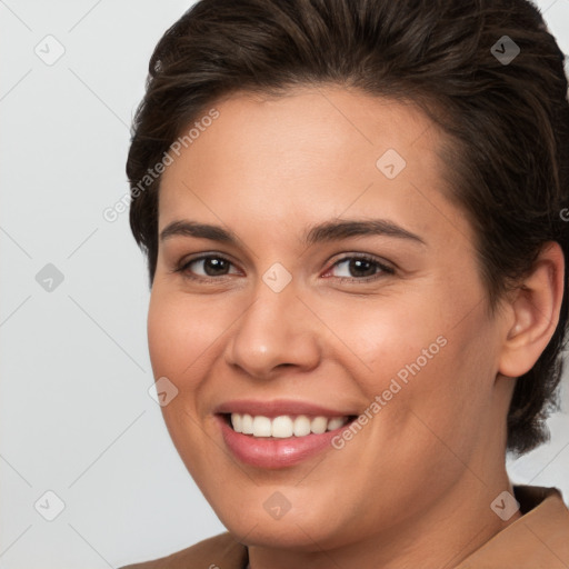 Joyful white young-adult female with medium  brown hair and brown eyes