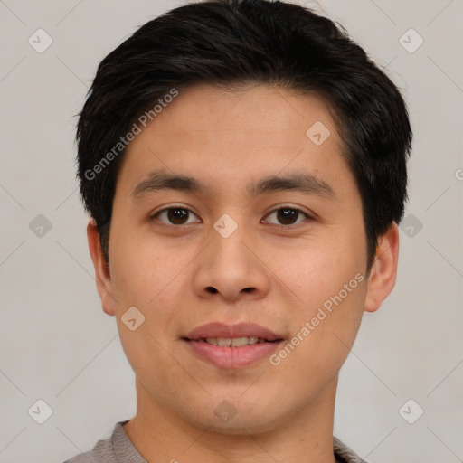 Joyful asian young-adult male with short  brown hair and brown eyes