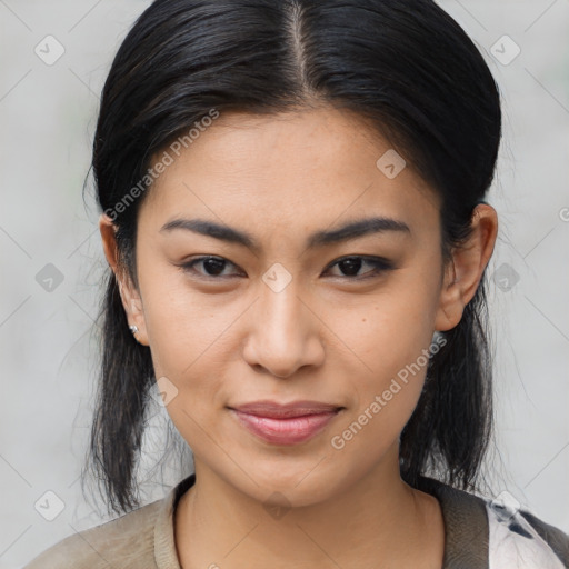 Joyful asian young-adult female with medium  black hair and brown eyes