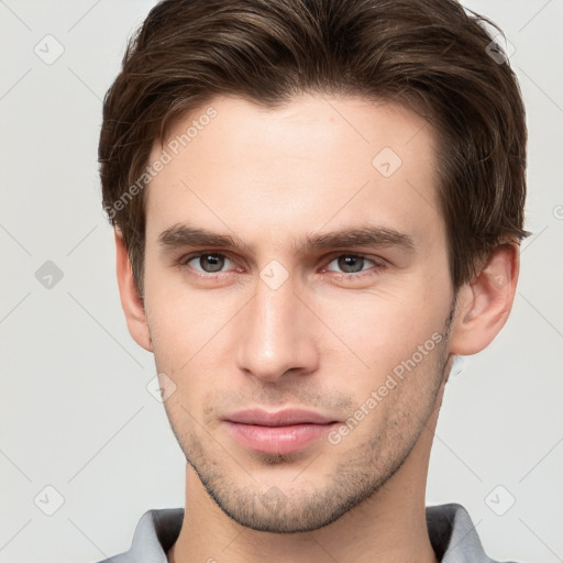 Neutral white young-adult male with short  brown hair and brown eyes