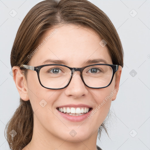 Joyful white young-adult female with medium  brown hair and green eyes