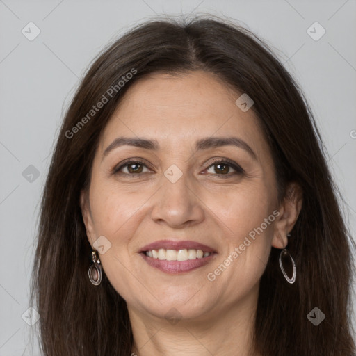 Joyful white adult female with long  brown hair and grey eyes