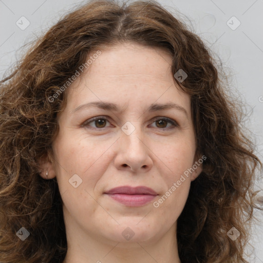 Joyful white adult female with long  brown hair and brown eyes