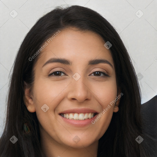 Joyful latino young-adult female with long  brown hair and brown eyes