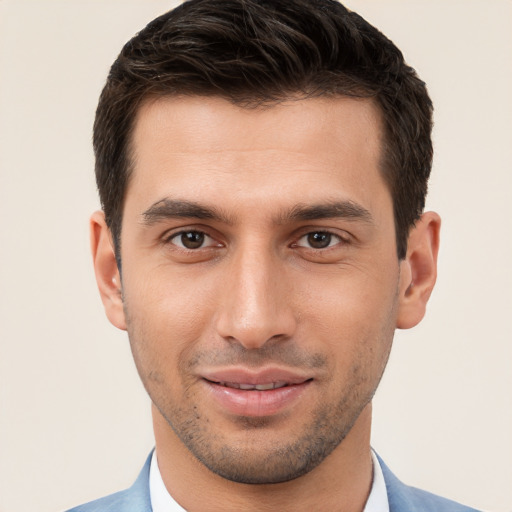 Joyful white young-adult male with short  brown hair and brown eyes