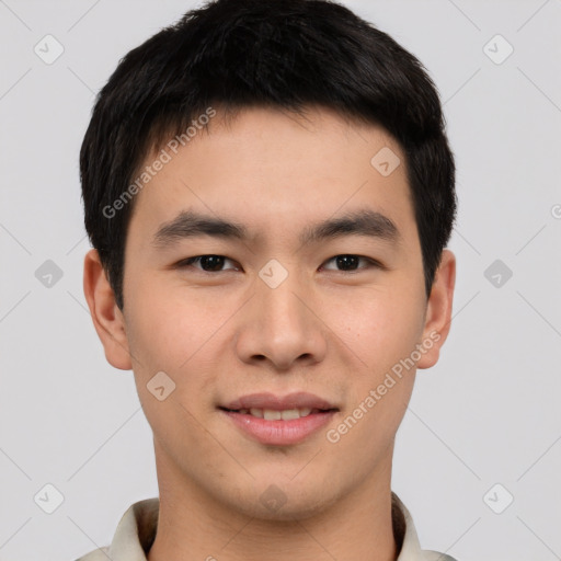 Joyful asian young-adult male with short  brown hair and brown eyes