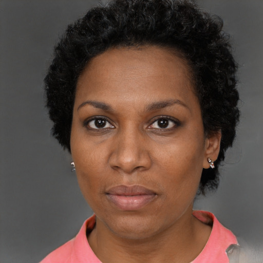 Neutral black adult female with short  brown hair and brown eyes