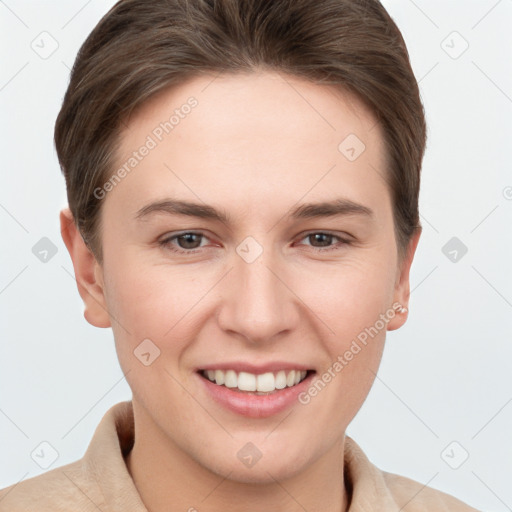 Joyful white young-adult female with short  brown hair and grey eyes