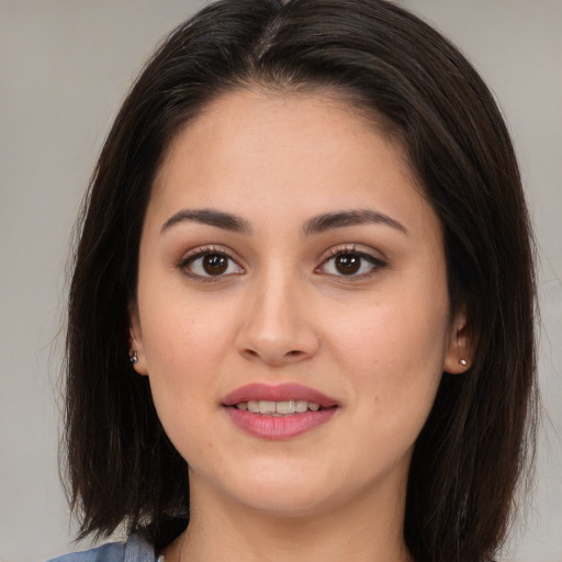 Joyful white young-adult female with medium  brown hair and brown eyes