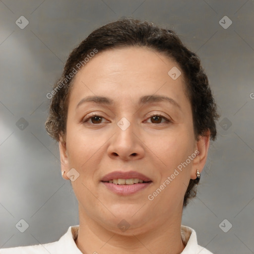 Joyful white adult female with short  brown hair and brown eyes