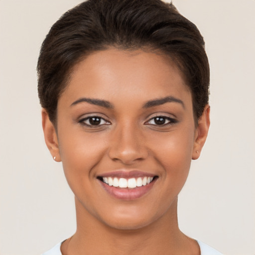 Joyful white young-adult female with short  brown hair and brown eyes