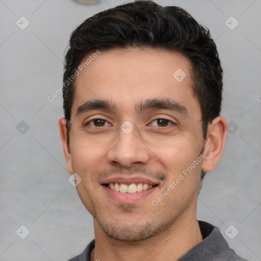 Joyful white young-adult male with short  black hair and brown eyes