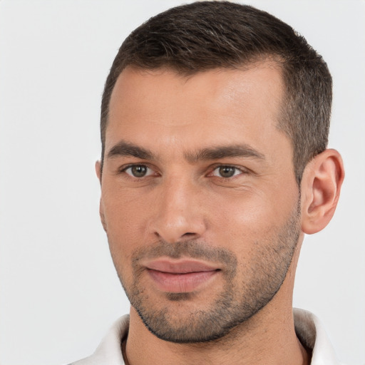 Joyful white young-adult male with short  brown hair and brown eyes