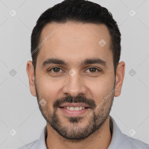 Joyful white young-adult male with short  black hair and brown eyes